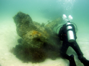 picture of diver with underwater artifacts