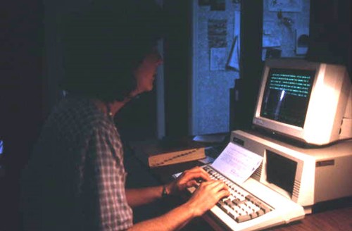 Photo of Ricki Saltzman working on a computer