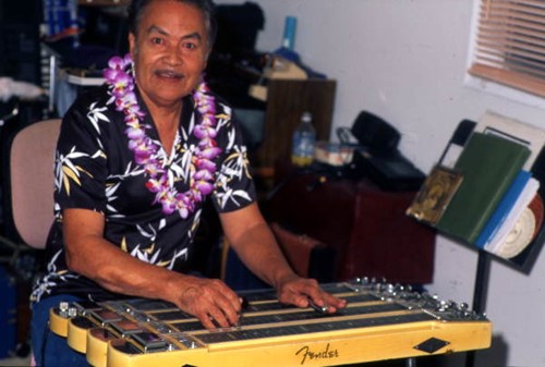 View of Richard "Dick" Sanft playing the Hawaiian steel guitar at his residence in Kissimmee, Florida.
